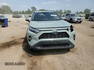 2022 Toyota RAV4 Hybrid XLE Premium with VIN 4T3B6RFV8NU101319, listed as a Copart auction lot 60987535 with 100,070 mi miles and Salvage title. Bid and sale history available at DreamBid. Image 14.