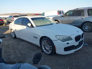 2013 BMW 7 Series 740i with VIN WBAYA6C54DD143796, listed as a IAAI auction lot 41433835 with 1 mi miles. Bid and sale history available at carsss.com. Image 1.