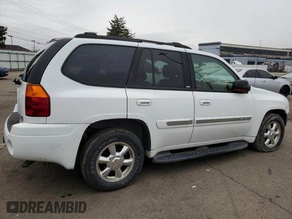 2003 GMC Envoy SLT with VIN 1GKDT13S332293112, listed as a Copart auction lot 43721225 with 139,471 mi miles and Salvage Title. Bid and sale history available at carsss.com. Image 3.