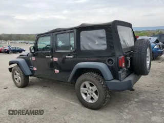2015 Jeep Wrangler Unlimited Willys Wheeler with VIN 1C4BJWDG3FL601197, listed as a Copart auction lot 53832465 with 216,141 mi miles and Salvage Title. Bid and sale history available at DreamBid. Image 2.