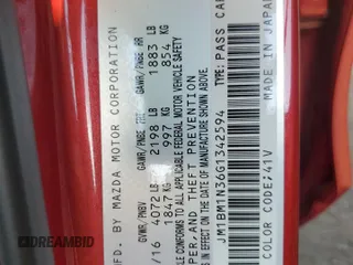 2016 Mazda 3 S Grand Touring z VIN JM1BM1N36G1342594, wystawiony jako Copart lot #57041185 z przebiegiem Nie podano mil oraz Szkoda całkowita • Salvage title. Historia ofert i sprzedaży dostępna na DreamBid. Obrazek 12.