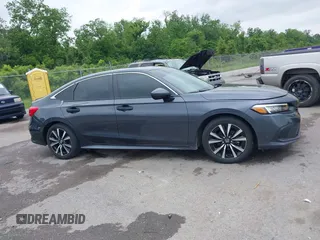 2023 Honda Civic EX with VIN 2HGFE1F73PH312228, listed as a IAAI auction lot 42185408 with 19,339 mi miles and . Bid and sale history available at DreamBid. Image 13.