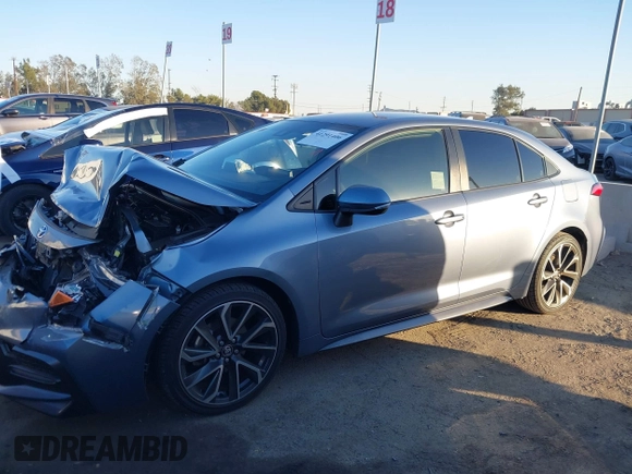 2022 Toyota Corolla SE with VIN JTDS4MCE9NJ082078, listed as a IAAI auction lot 41291406 with 57,202 mi miles and . Bid and sale history available at DreamBid. Image 14.