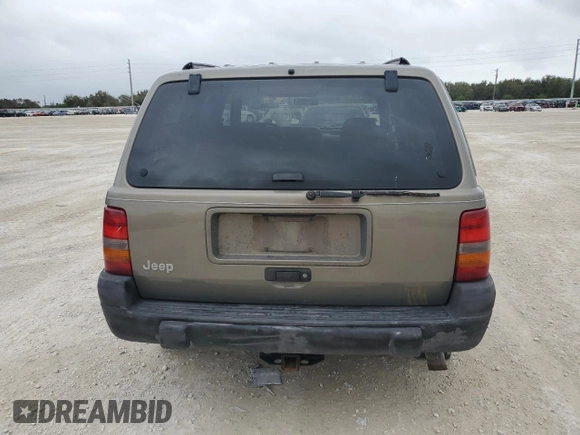 1998 Jeep Grand Cherokee Laredo with VIN 1J4GZ58S6WC137968, listed as a Copart auction lot 84083454 with 0 mi miles and Non Repairable. Bid and sale history available at carsss.com. Image 6.