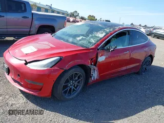 2020 Tesla Model 3 Standard Range Plus with VIN 5YJ3E1EA7LF706636, listed as a IAAI auction lot 32371217 with 35,389 mi miles. Bid and sale history available at carsss.com. Image 6.