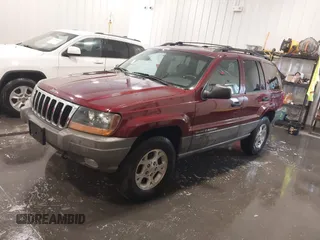 2000 Jeep Grand Cherokee Laredo z VIN 1J4GW48N8YC151600, wystawiony jako IAAI lot #42178535 z przebiegiem 71 207 mil mil oraz . Historia ofert i sprzedaży dostępna na DreamBid. Obrazek 2.