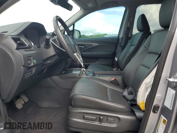 2023 Honda Ridgeline RTL-E with VIN 5FPYK3F70PB018858, listed as a Copart auction lot 64210205 with 16,562 mi miles and Salvage title. Bid and sale history available at DreamBid. Image 7.