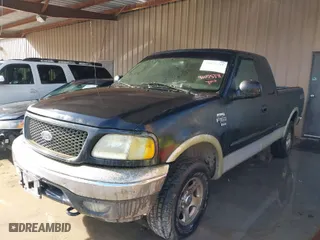 2000 Ford F-150 XL with VIN 1FTRX18LXYNA19385, listed as a IAAI auction lot 41075391 with 214,624 mi miles. Bid and sale history available at carsss.com. Image 2.