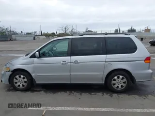 2003 Honda Odyssey EX-L with VIN 5FNRL18943B030373, listed as a IAAI auction lot 41867289 with 179,718 mi miles and . Bid and sale history available at DreamBid. Image 14.