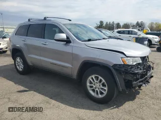 2018 Jeep Grand Cherokee Laredo E with VIN 1C4RJFAG0JC351090, listed as a Copart auction lot 52958635 with 96,956 mi miles and Salvage Title. Bid and sale history available at DreamBid. Image 4.
