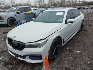 2016 BMW 7 Series 740i with VIN WBA7E2C50GG714647, listed as a IAAI auction lot 41745442 with 134,399 mi miles and . Bid and sale history available at carsss.com. Image 2.