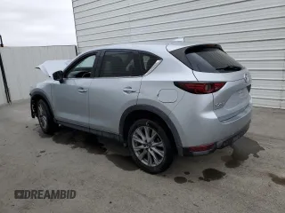 2021 Mazda CX-5 Grand Touring z VIN JM3KFADM7M1339081, wystawiony jako Copart lot #58913585 z przebiegiem Nie podano mil oraz Szkoda całkowita • Salvage title. Historia ofert i sprzedaży dostępna na DreamBid. Obrazek 2.