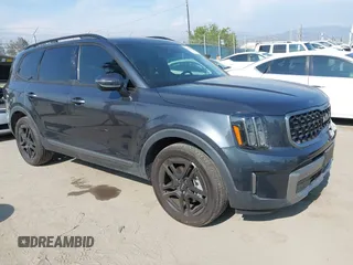 2023 Kia Telluride EX X-Line z VIN 5XYP3DGCXPG394527, wystawiony jako IAAI lot #42172304 z przebiegiem 18 887 mil mil oraz . Historia ofert i sprzedaży dostępna na DreamBid. Obrazek 1.
