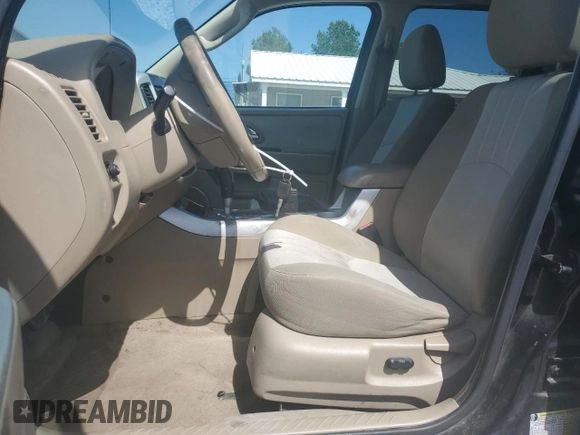 2007 Mercury Mariner Luxury with VIN 4M2YU91177KJ13634, listed as a Copart auction lot 56946825 with 167,163 mi miles and Clean title. Bid and sale history available at DreamBid. Image 7.