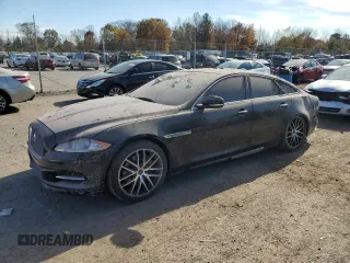2015 Jaguar XJ с VIN SAJWJ1CD1F8V90815, выставлен на аукционе Copart как лот 77977464 с пробегом Не указан миль и Списание • Salvage title. История ставок и продаж доступна на DreamBid. Изображение 1.