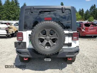 2014 Jeep Wrangler Unlimited Sahara z VIN 1C4BJWEG8EL188271, wystawiony jako Copart lot #59972535 z przebiegiem 130 314 mil mil oraz Szkoda całkowita • Salvage title. Historia ofert i sprzedaży dostępna na DreamBid. Obrazek 6.