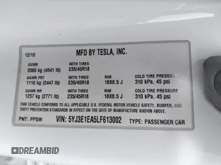 2020 Tesla Model 3 Standard Range Plus with VIN 5YJ3E1EA5LF613002, listed as a IAAI auction lot 42129085 with 55,672 mi miles. Bid and sale history available at carsss.com. Image 9.