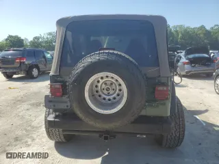 1999 Jeep Wrangler Sahara with VIN 1J4FY49S6XP478675, listed as a Copart auction lot 52147605 with 157,971 mi miles and Salvage Title. Bid and sale history available at carsss.com. Image 10.