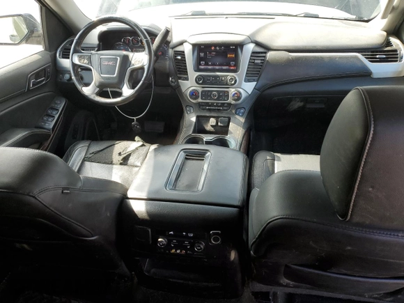 2015 GMC Yukon SLT with VIN 1GKS2BKC6FR145140, listed as a Copart auction lot 55451365 with 216,522 mi miles and Salvage Title. Bid and sale history available at DreamBid. Image 8.