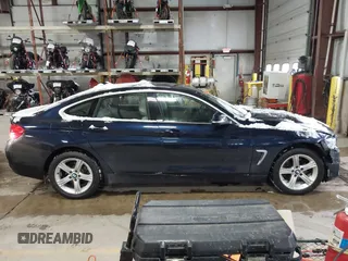 2015 BMW 4 Series 428i xDrive with VIN WBA4A7C57FD414955, listed as a IAAI auction lot 41609214 with 69,125 mi miles and . Bid and sale history available at DreamBid. Image 13.