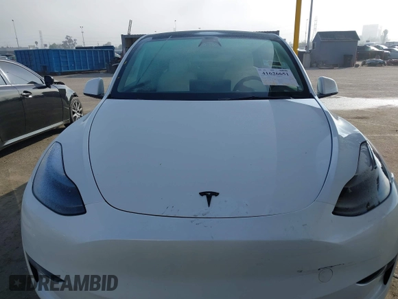 2023 Tesla Model Y Long Range with VIN 7SAYGAEE7PF766735, listed as a IAAI auction lot 41626651 with 21,983 mi miles. Bid and sale history available at carsss.com. Image 13.
