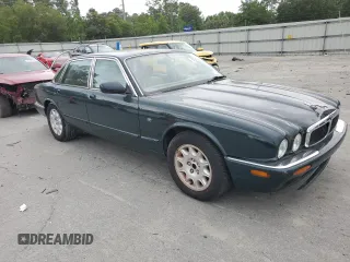 1999 Jaguar XJ with VIN SAJHX1044XC865054, listed as a Copart auction lot 57825325 with 71,145 mi miles and Clean title. Bid and sale history available at DreamBid. Image 4.