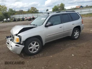2007 GMC Envoy SLT with VIN 1GKDT13S272265100, listed as a Copart auction lot 73136264 with 245,198 mi miles and Salvage Title. Bid and sale history available at carsss.com. Image 1.