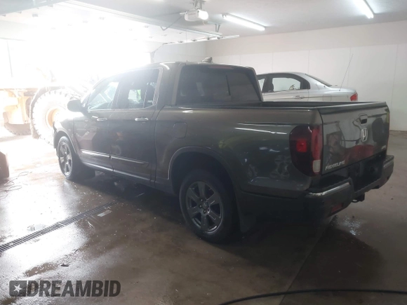 2020 Honda Ridgeline RTL-E with VIN 5FPYK3F75LB001516, listed as a IAAI auction lot 41605859 with 93,902 mi miles and . Bid and sale history available at DreamBid. Image 3.