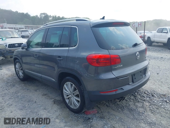2014 Volkswagen Tiguan SE z VIN WVGAV3AX0EW576108, wystawiony jako IAAI lot #42405804 z przebiegiem 117 530 mil mil oraz . Historia ofert i sprzedaży dostępna na DreamBid. Obrazek 3.