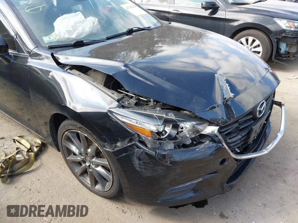 2018 Mazda 3 Touring with VIN 3MZBN1V34JM261565, listed as a IAAI auction lot 41795238 with 121,112 mi miles. Bid and sale history available at carsss.com. Image 6.