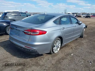 2020 Ford Fusion SE z VIN 3FA6P0LU8LR163896, wystawiony jako IAAI lot #41994803 z przebiegiem 89 892 mil mil oraz . Historia ofert i sprzedaży dostępna na DreamBid. Obrazek 4.