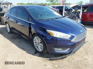 2017 Ford Focus Titanium z VIN 1FADP3J29HL204892, wystawiony jako IAAI lot #42032705 z przebiegiem 119 028 mil mil oraz . Historia ofert i sprzedaży dostępna na DreamBid. Obrazek 1.