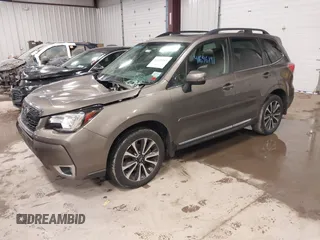 2017 Subaru Forester Touring with VIN JF2SJGWC0HH810100, listed as a IAAI auction lot 41646141 with 69,556 mi miles. Bid and sale history available at carsss.com. Image 2.
