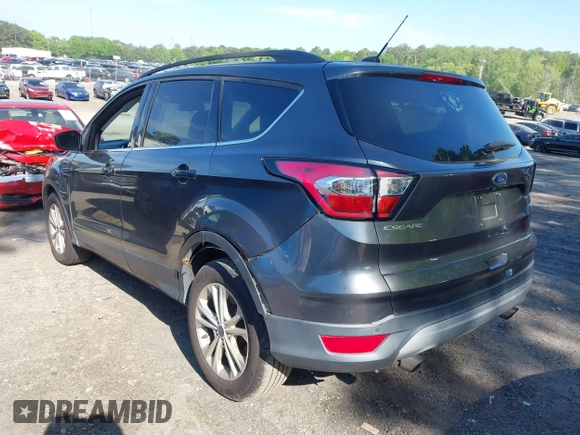 2017 Ford Escape SE z VIN 1FMCU0GDXHUB66813, wystawiony jako IAAI lot #42056150 z przebiegiem 86 915 mil mil oraz . Historia ofert i sprzedaży dostępna na DreamBid. Obrazek 3.