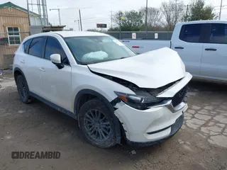 2020 Mazda CX-5 Touring with VIN JM3KFACM9L0771919, listed as a IAAI auction lot 41527773 with 93,417 mi miles and . Bid and sale history available at DreamBid. Image 1.