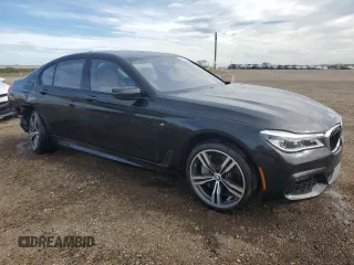 2019 BMW 7 Series 750i xDrive with VIN WBA7B0C53KG527537, listed as a Copart auction lot 64113345 with 36,820 mi miles and Salvage title. Bid and sale history available at DreamBid. Image 4.