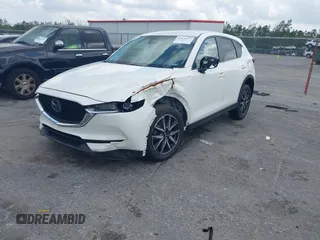 2018 Mazda CX-5 Touring z VIN JM3KFACM6J1419663, wystawiony jako IAAI lot #41879677 z przebiegiem 115 224 mil mil oraz . Historia ofert i sprzedaży dostępna na DreamBid. Obrazek 22.