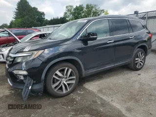 2017 Honda Pilot Touring with VIN 5FNYF6H90HB024321, listed as a Copart auction lot 57459895 with 134,244 mi miles and Salvage title. Bid and sale history available at DreamBid. Image 1.