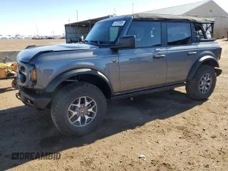 2023 Ford Bronco z VIN 1FMEE5DP0PLC10002, wystawiony jako Copart lot #57272555 z przebiegiem 14 035 mil mil oraz Szkoda całkowita • Salvage title. Historia ofert i sprzedaży dostępna na DreamBid. Obrazek 1.