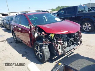 2018 Toyota RAV4 XLE with VIN 2T3WFREV8JW425464, listed as a IAAI auction lot 41977877 with 142,265 mi miles and . Bid and sale history available at carsss.com. Image 1.