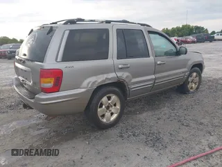 2001 Jeep Grand Cherokee Limited with VIN 1J4GW58N31C510766, listed as a IAAI auction lot 42107607 with 305,893 mi miles and . Bid and sale history available at DreamBid. Image 4.