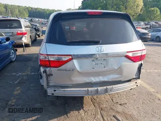 2013 Honda Odyssey EX-L with VIN 5FNRL5H6XDB084016, listed as a IAAI auction lot 42044300 with 156,296 mi miles and . Bid and sale history available at carsss.com. Image 6.