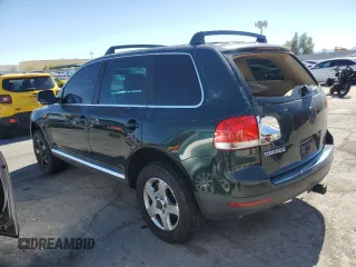 2005 Volkswagen Touareg z VIN WVGBG77L25D010568, wystawiony jako Copart lot #57268755 z przebiegiem 229 928 mil mil oraz Szkoda całkowita • Salvage title. Historia ofert i sprzedaży dostępna na DreamBid. Obrazek 2.
