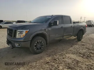 2017 Nissan Titan Pro-4X z VIN 1N6BA1F4XHN520692, wystawiony jako Copart lot #49459435 z przebiegiem 107 311 mil mil oraz Szkoda całkowita • Salvage title. Historia ofert i sprzedaży dostępna na DreamBid. Obrazek 1.