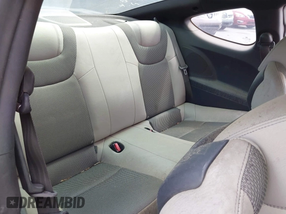 2013 Hyundai Genesis Coupe Premium z VIN KMHHT6KD8DU087203, wystawiony jako IAAI lot #42018152 z przebiegiem 104 354 mil mil oraz . Historia ofert i sprzedaży dostępna na DreamBid. Obrazek 8.