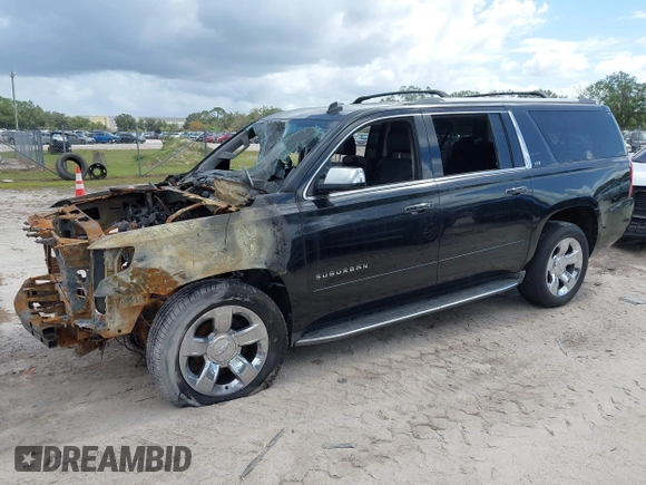 2015 Chevrolet Suburban LTZ with VIN 1GNSCKKC8FR156706, listed as a IAAI auction lot 40638221 with Not Provided miles and . Bid and sale history available at DreamBid. Image 2.