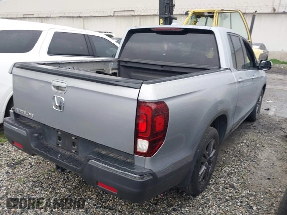 2018 Honda Ridgeline Sport with VIN 5FPYK2F19JB000713, listed as a IAAI auction lot 41300244 with 52,119 mi miles and . Bid and sale history available at DreamBid. Image 4.