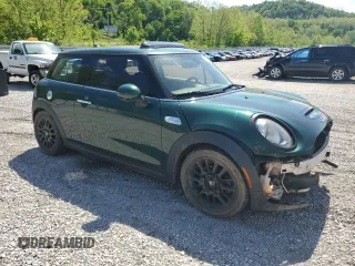 2014 MINI Hardtop S with VIN WMWXM7C50ET970033, listed as a Copart auction lot 56160735 with 125,208 mi miles and Salvage title. Bid and sale history available at DreamBid. Image 4.