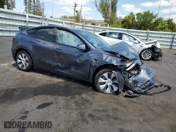 2023 Tesla Model Y Long Range with VIN 7SAYGDEE9PF885405, listed as a Copart auction lot 52858105 with 23,424 mi miles and Non Repairable. Bid and sale history available at DreamBid. Image 4.