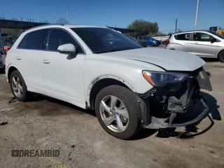 2020 Audi Q3 Premium with VIN WA1AECF30L1023652, listed as a Copart auction lot 57148915 with 69,621 mi miles and Salvage title. Bid and sale history available at DreamBid. Image 4.